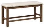 Beige upholstered bench with tufted seat, nailhead trim, and dark wood legs