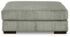 Gray ottoman with ribbed fabric upholstery and rounded square top on short legs