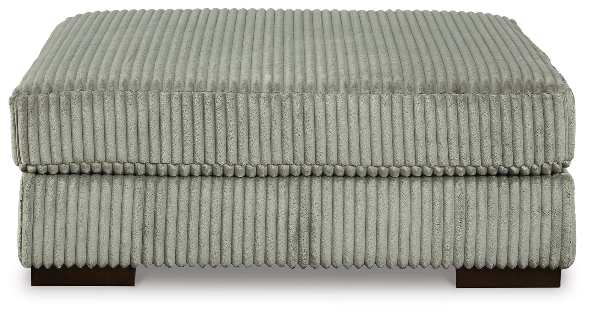 Gray ottoman with ribbed fabric upholstery and rounded square top on short legs