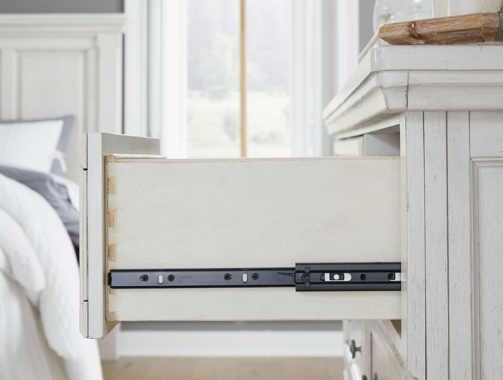 Antique white dresser drawer with dark metal sliding hardware and track