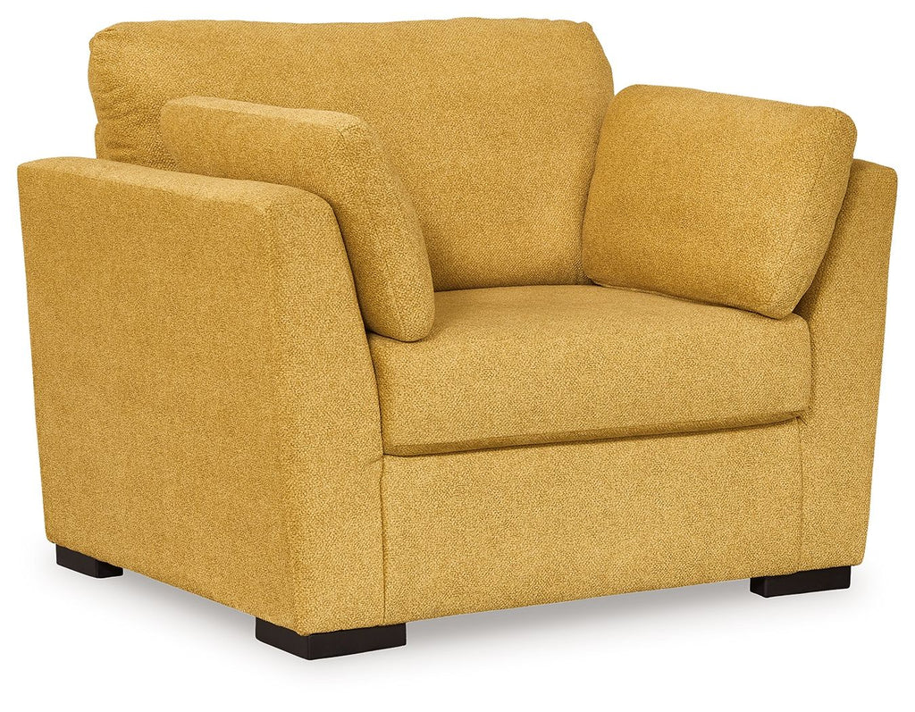 Yellow upholstered armchair with square arms and low dark base