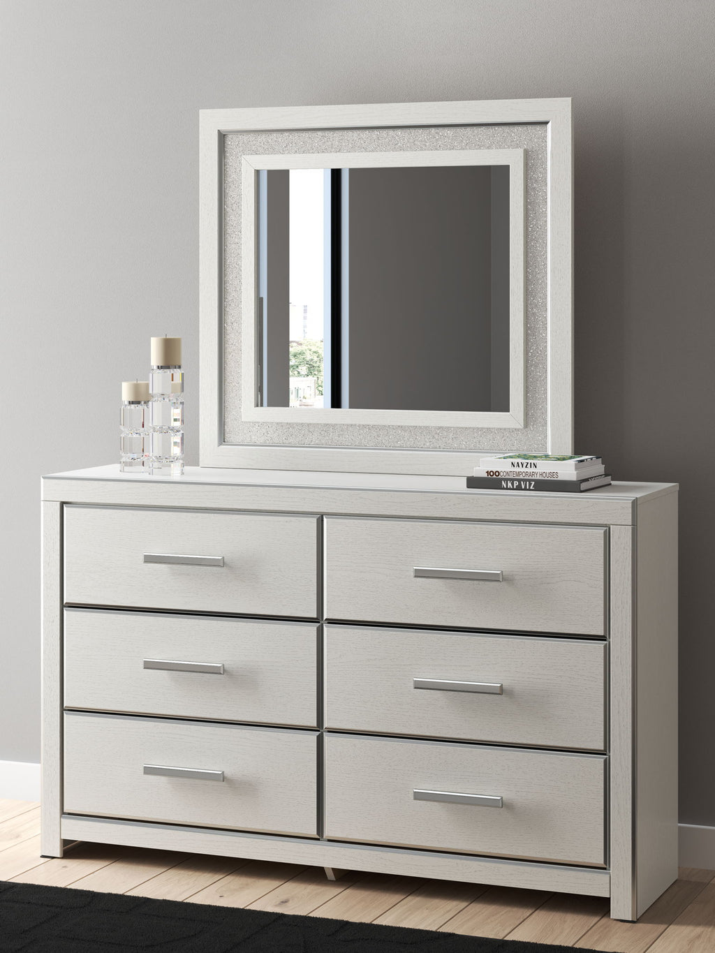 Six-drawer dresser with mirror frame in white finish, six drawers, and silver bar handles.