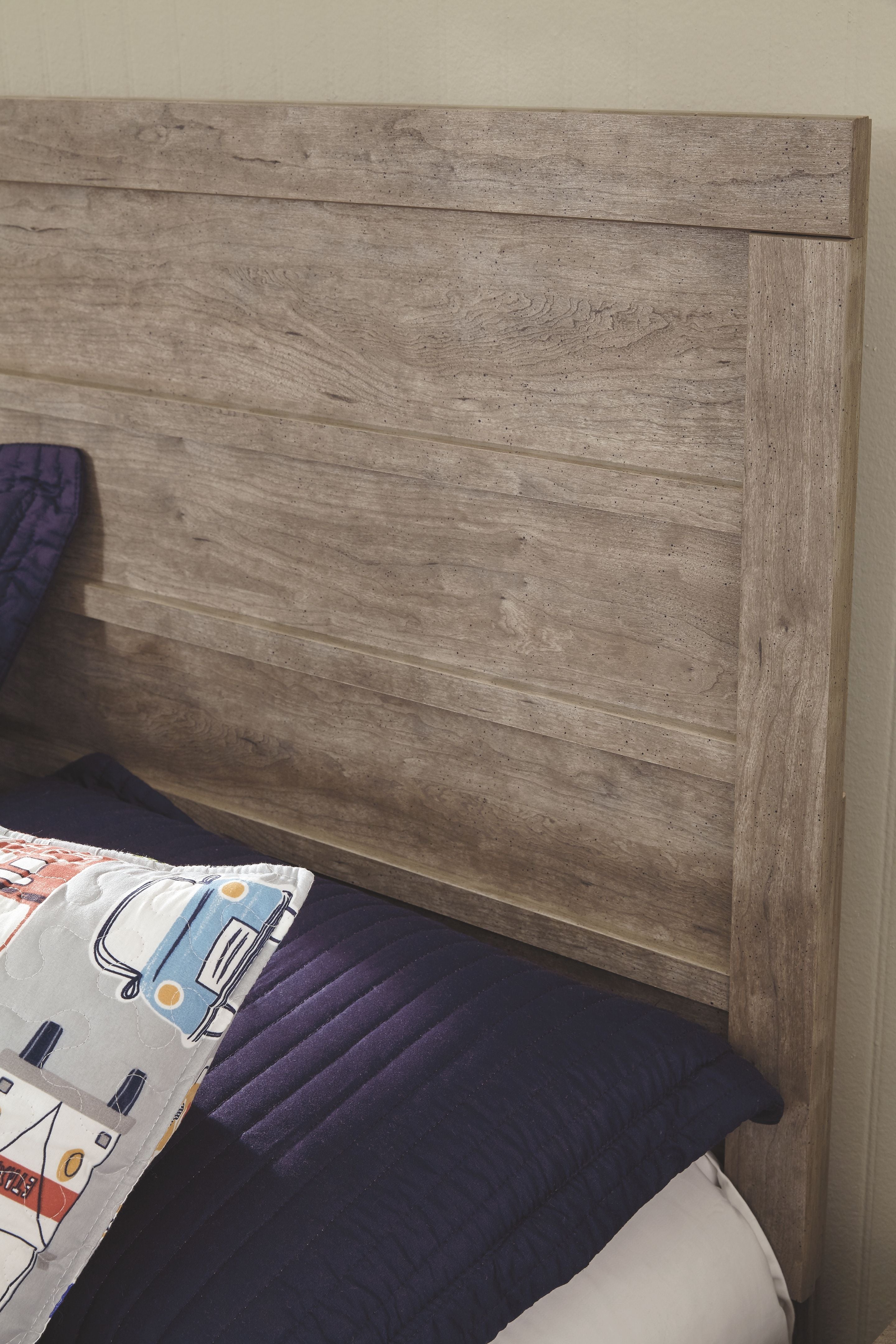 Gray wood panel headboard with horizontal slats and matching side rails