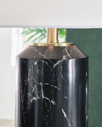 Black lamp base with white marble veining and gold top collar