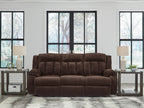 Chocolate brown reclining power sofa with tufted back, chaise-style seating, and arms