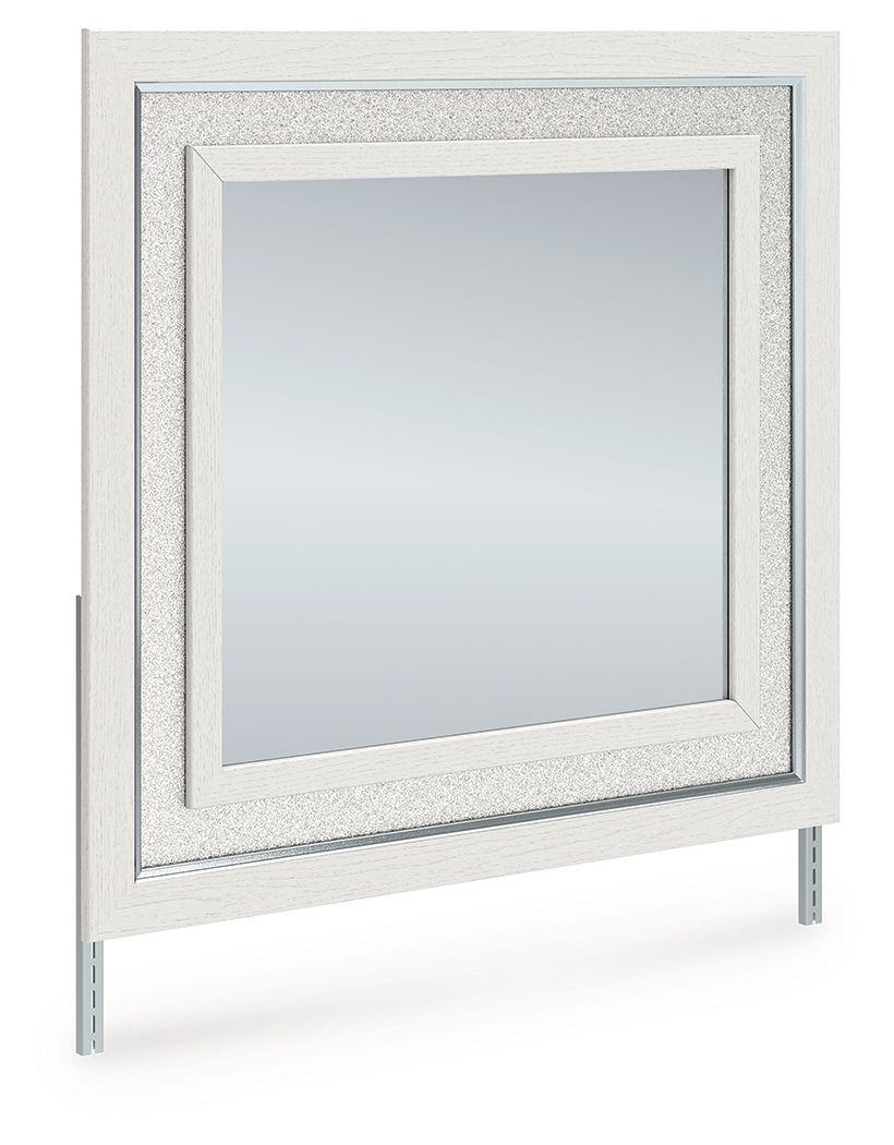 Bedroom mirror with light wood frame, inner border, and side wall-mount brackets.