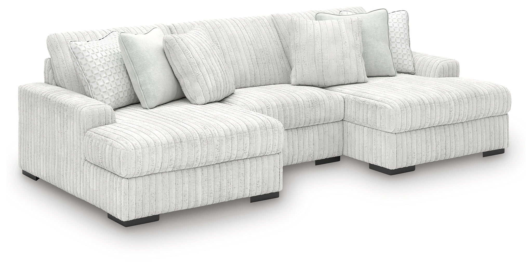 Off-white striped sectional sofa with chaise corner and rounded arms.