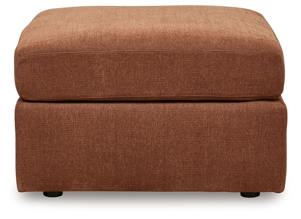 Light brown upholstered accent ottoman with cushioned top and square base