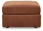 Light brown upholstered accent ottoman with cushioned top and square base