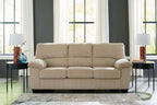 Light beige corduroy sofa with tufted back and three seat cushions