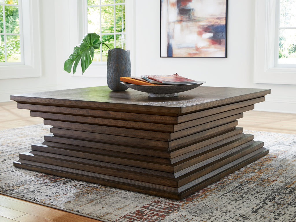 Square cocktail table, warm brown, with stacked base and square tabletop