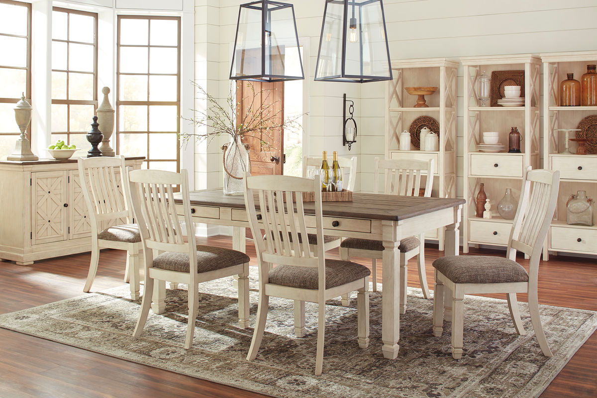 Rectangular dining table set with dark tabletop, beige upholstered chairs, and matching server