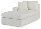 Corner chaise with light oyster upholstery, deep seat and two tall back pillows