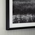 Framed wall art with black frame and black-and-white textured panel