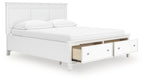 White panel bed with two underbed drawers, open storage, and three-part headboard