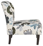Accent chair with blue-gray flower pattern fabric, curved back, dark wood legs.