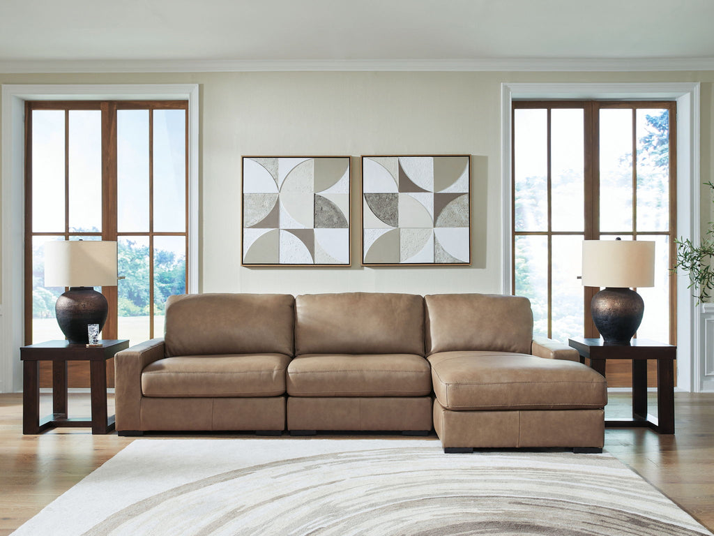 Taupe sectional sofa with chaise extension, boxy arms, and cushioned seat and back