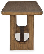 Rectangular dining table with dark brown tabletop and carved wood pedestal legs