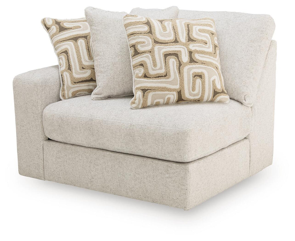 Kestrie LAF corner chair, light beige upholstered seat with two decorative geometric pillows