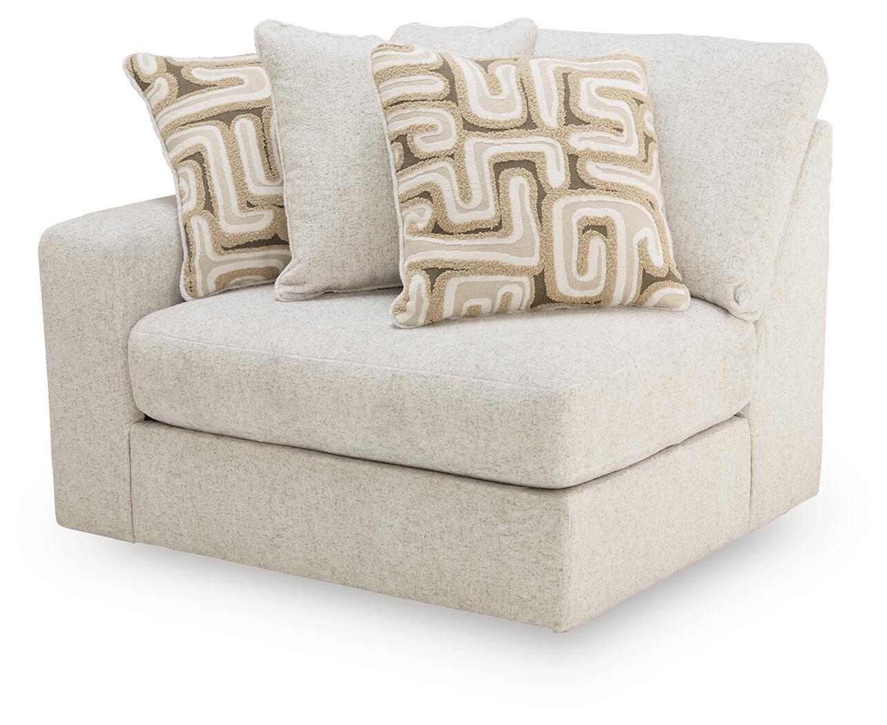 Kestrie LAF corner chair, light beige upholstered seat with two decorative geometric pillows