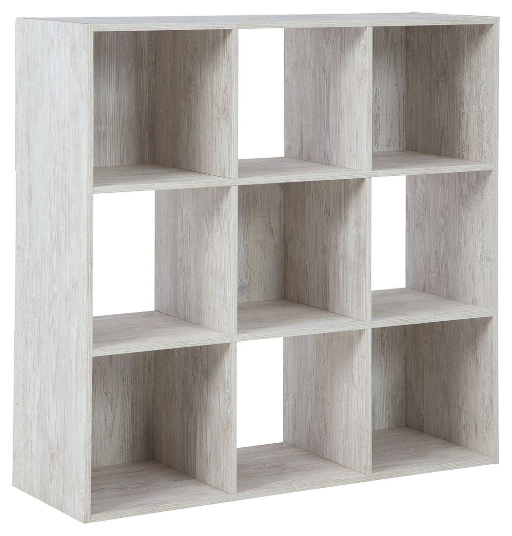 Whitewashed wood cube organizer with open square cubbies and divider shelves
