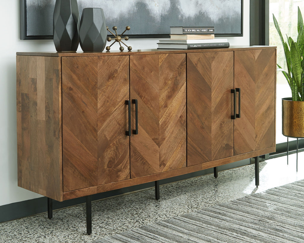 Brown accent cabinet with four panel doors and black bar handles