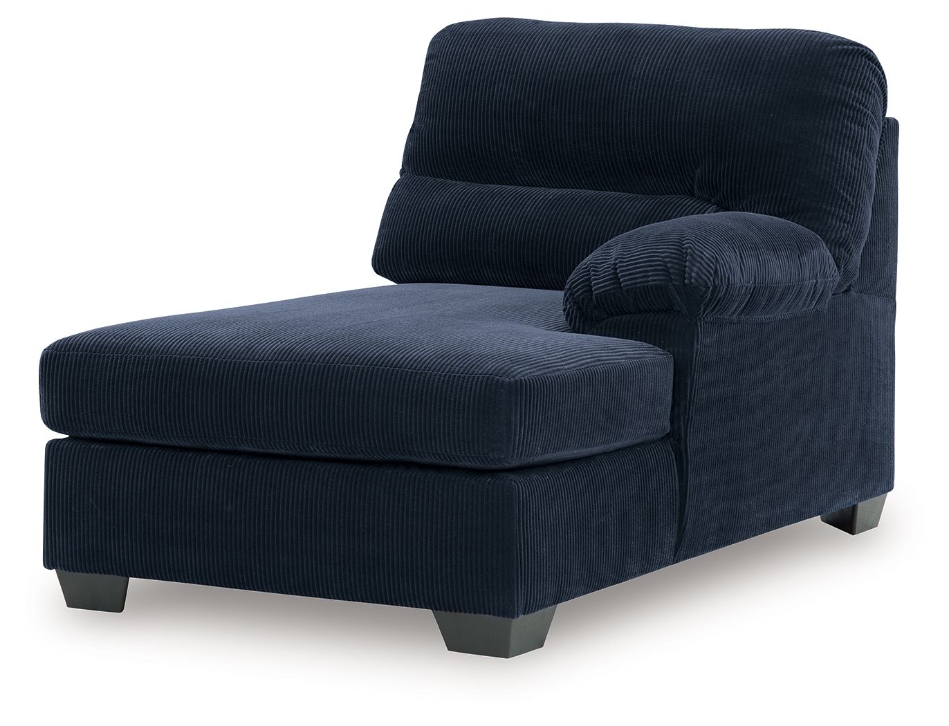 Navy ribbed corner chaise with thick seat, curved back, and bolster pillow
