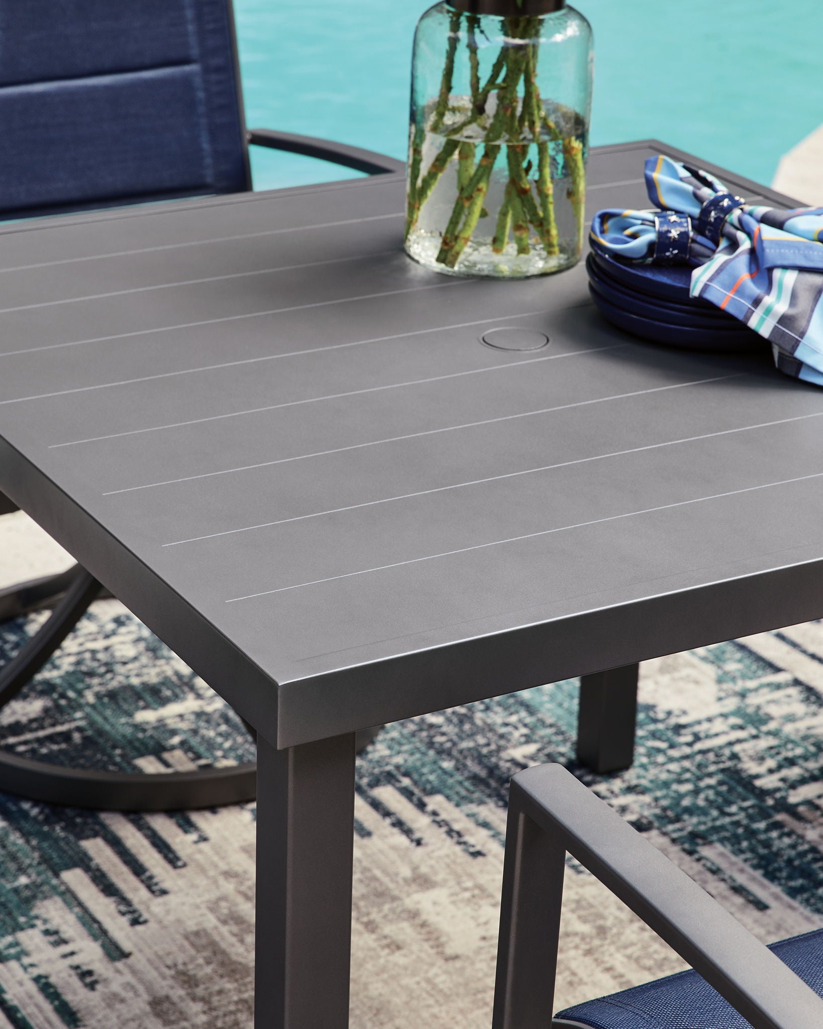 Gray square dining table with round umbrella hole in the tabletop