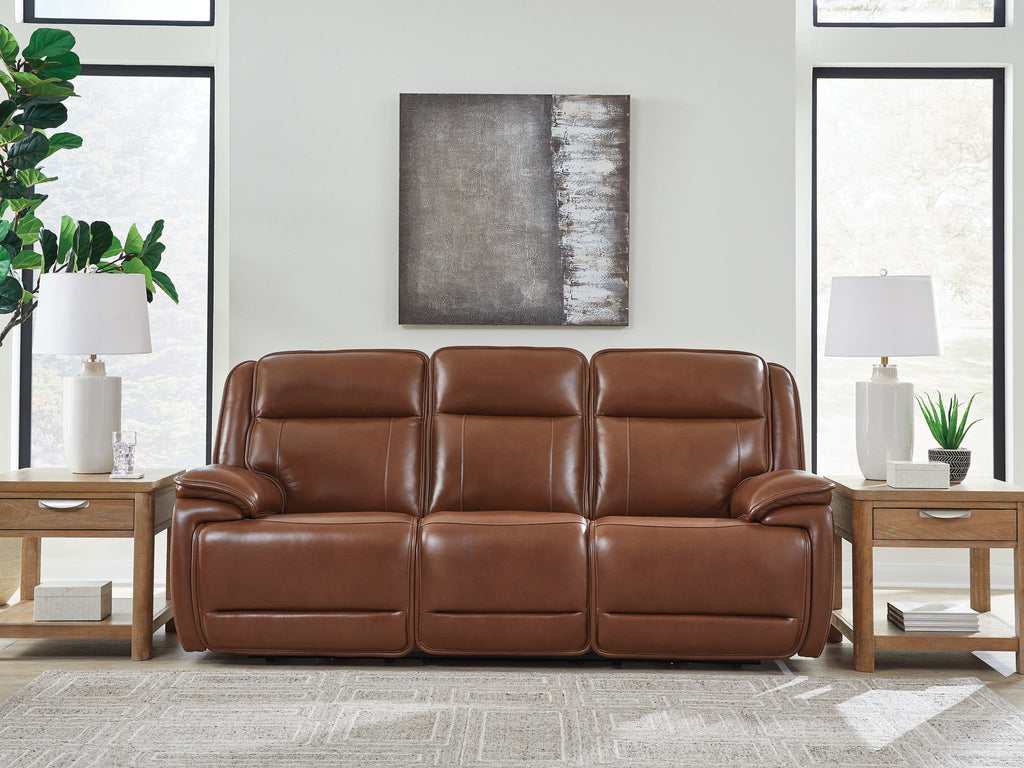 Dark brown leather power reclining sofa with three padded sections and recline seams