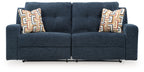 Ink blue 2-seat reclining sofa front view with two armrests and patterned back pillows