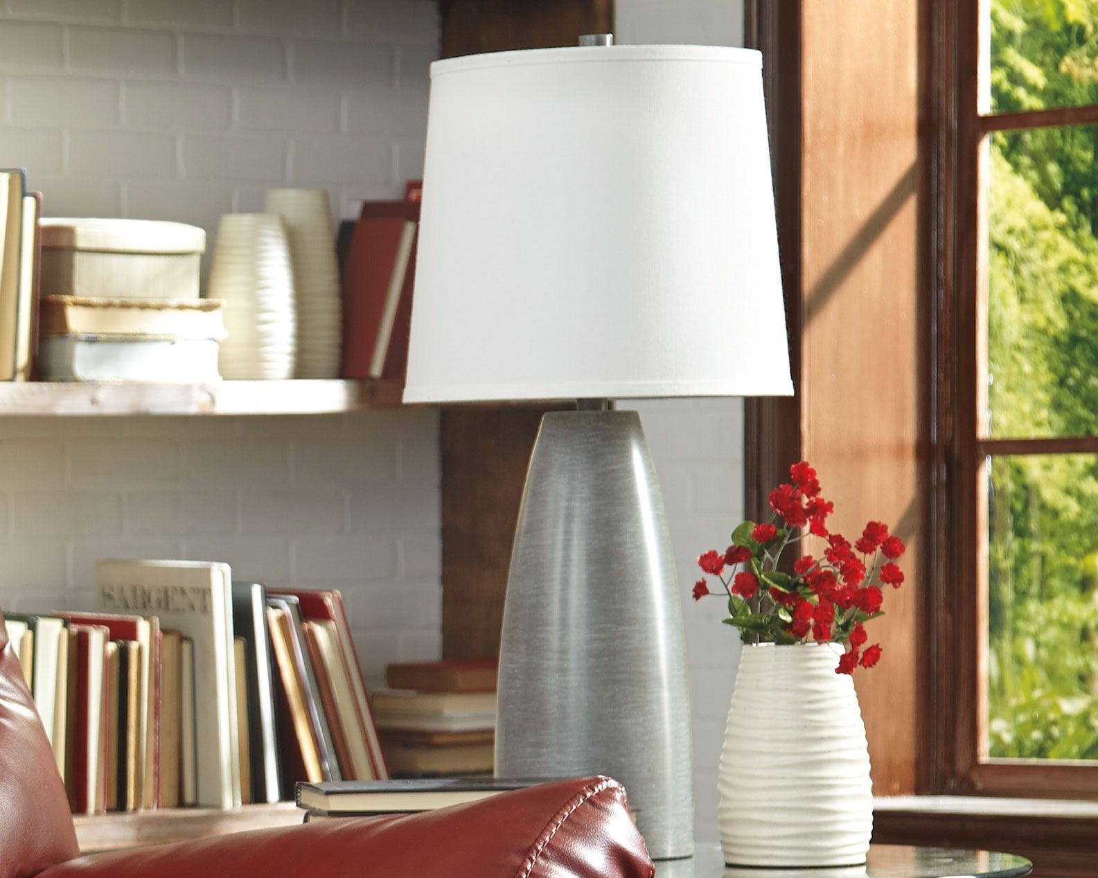 Table lamp with white fabric shade and dark gray textured base