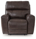 Smoke-brown upholstered power recliner with wide armrests and cushioned backrest