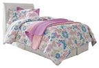 White sleigh bed headboard with tall curved design and floral bedding set