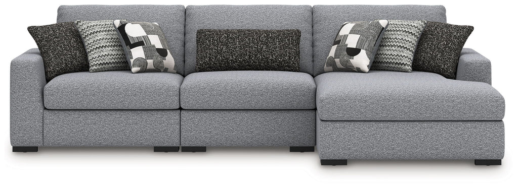 Gray sectional sofa with center console and patterned throw pillows