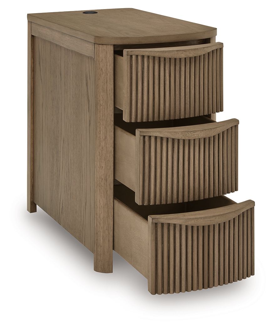 Light brown chair side end table with three stacked open drawers and vertical slat panels