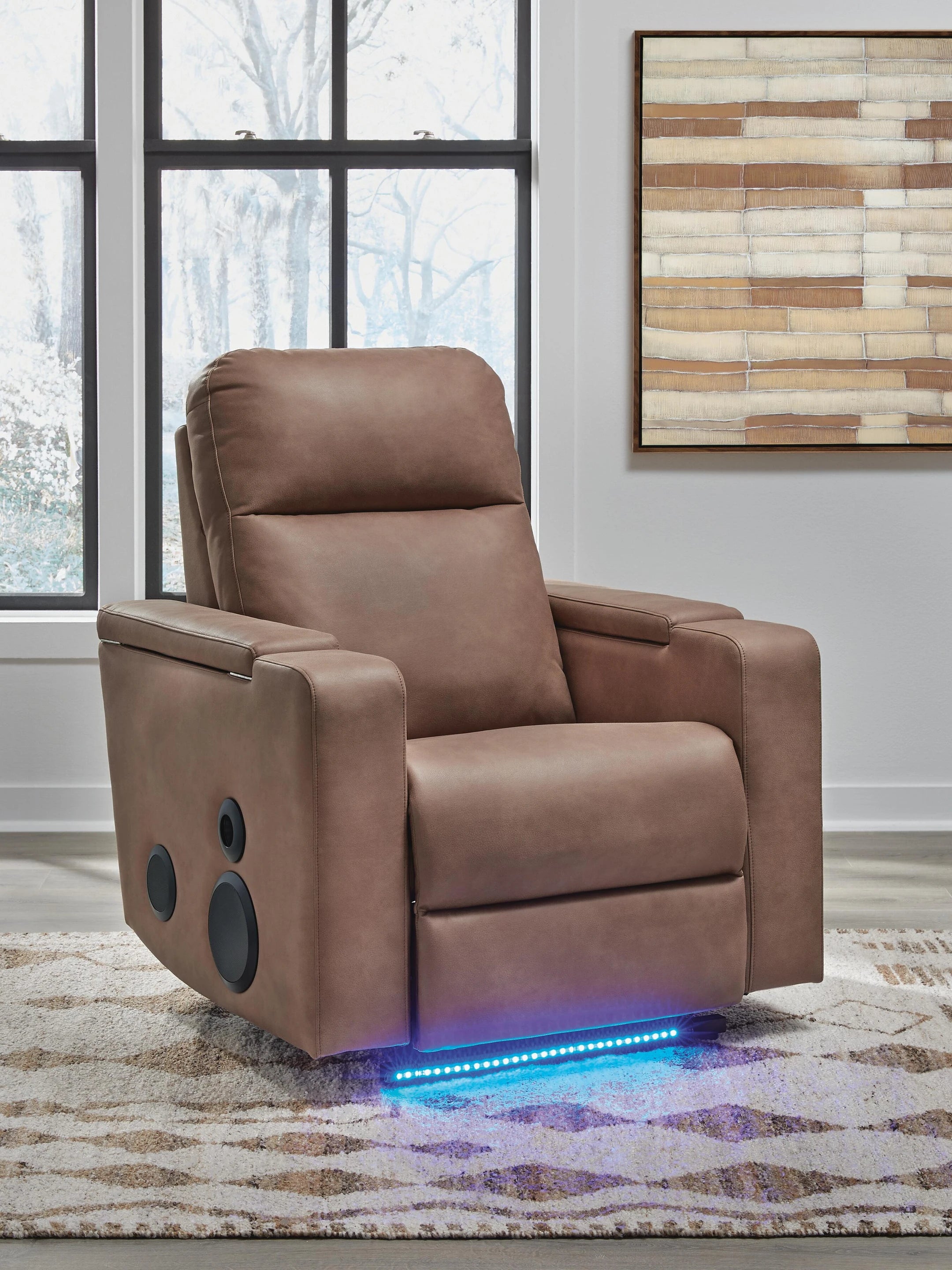 Caramel brown power recliner armchair with padded headrest and circular side accents