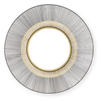 Round accent mirror with black ribbed frame and gold inner ring