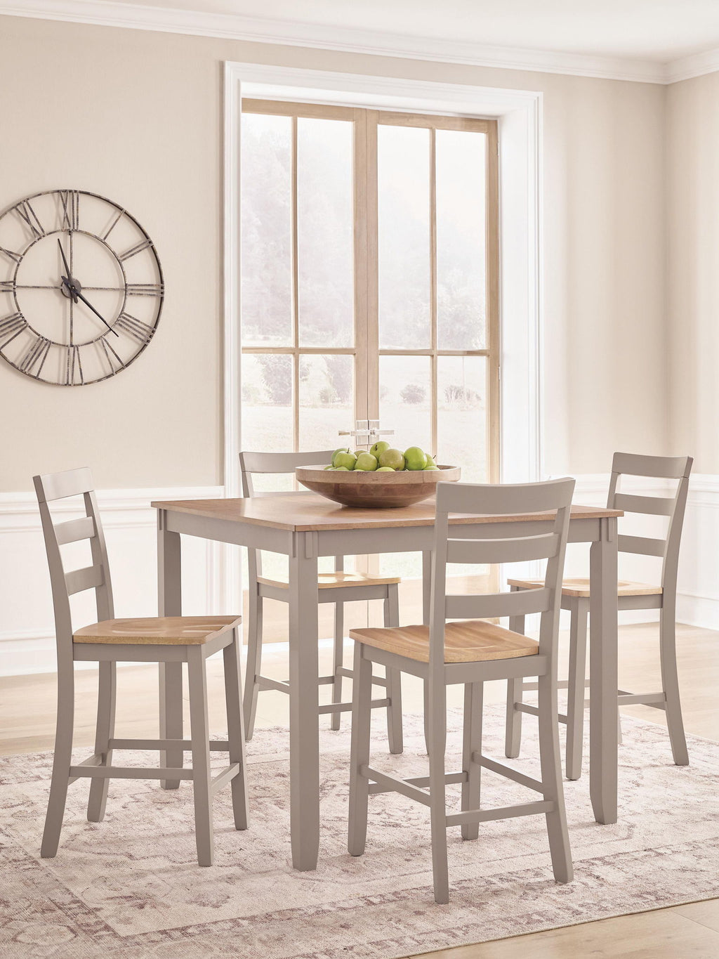 Dining table with light wood top and four gray chairs