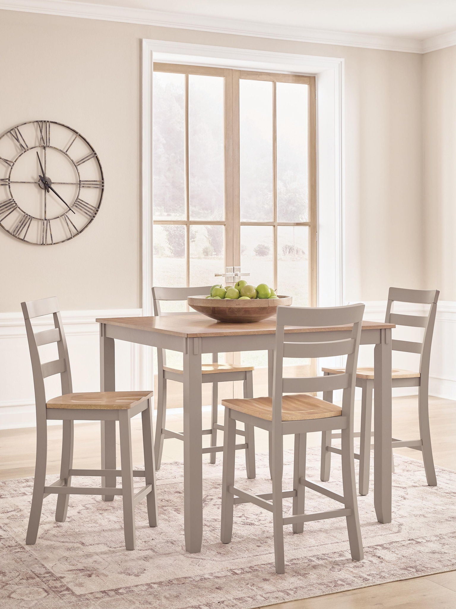 Dining table with light wood top and four gray chairs