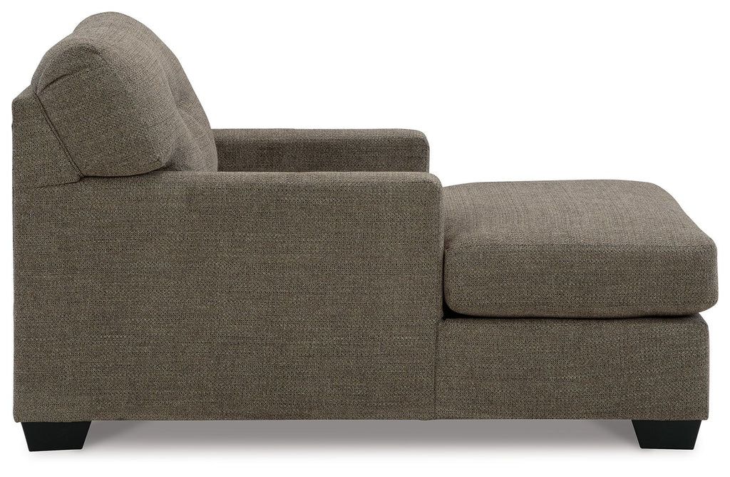 Dark brown upholstered chaise chair with rounded back, track arms, and matching ottoman