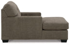 Dark brown upholstered chaise chair with rounded back, track arms, and matching ottoman