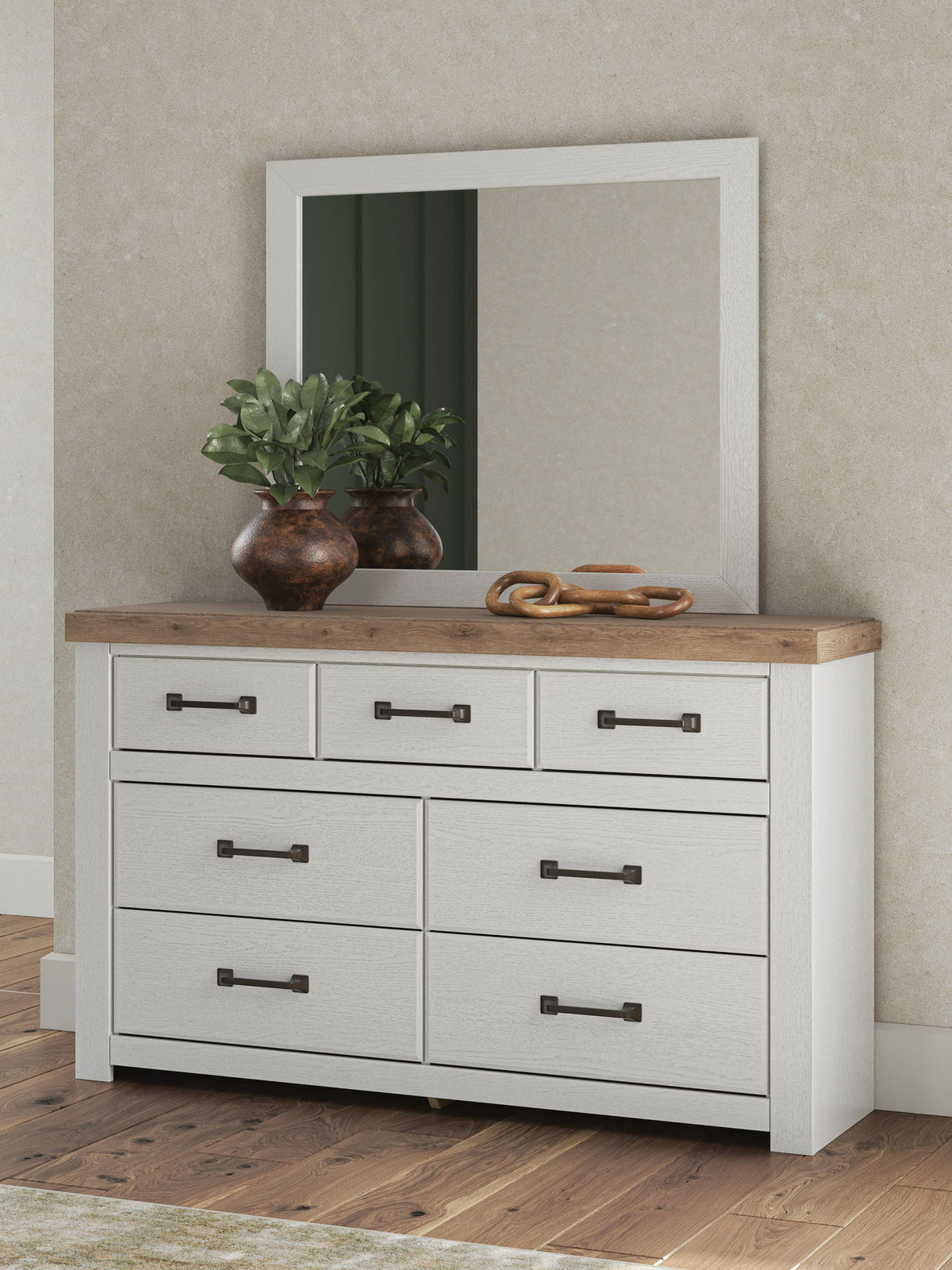White dresser with wood top, six drawers, dark bar pulls, wall mirror