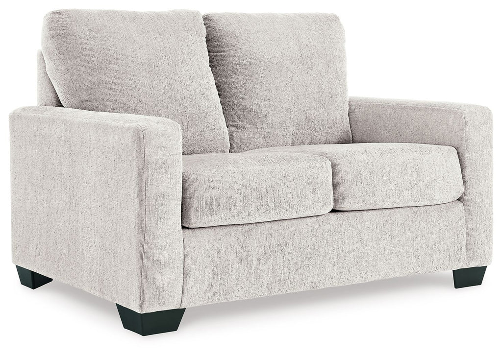 Light beige upholstered sofa with padded back and armrests