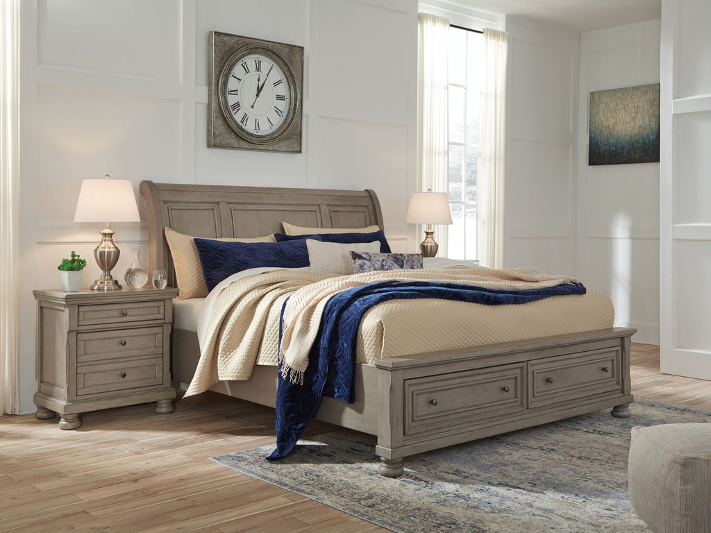 Lettner sleigh bed, gray frame with two drawers and blue-and-cream bedding