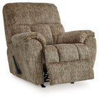 Taupe rocker recliner chair with padded arms and panel stitching, side lever