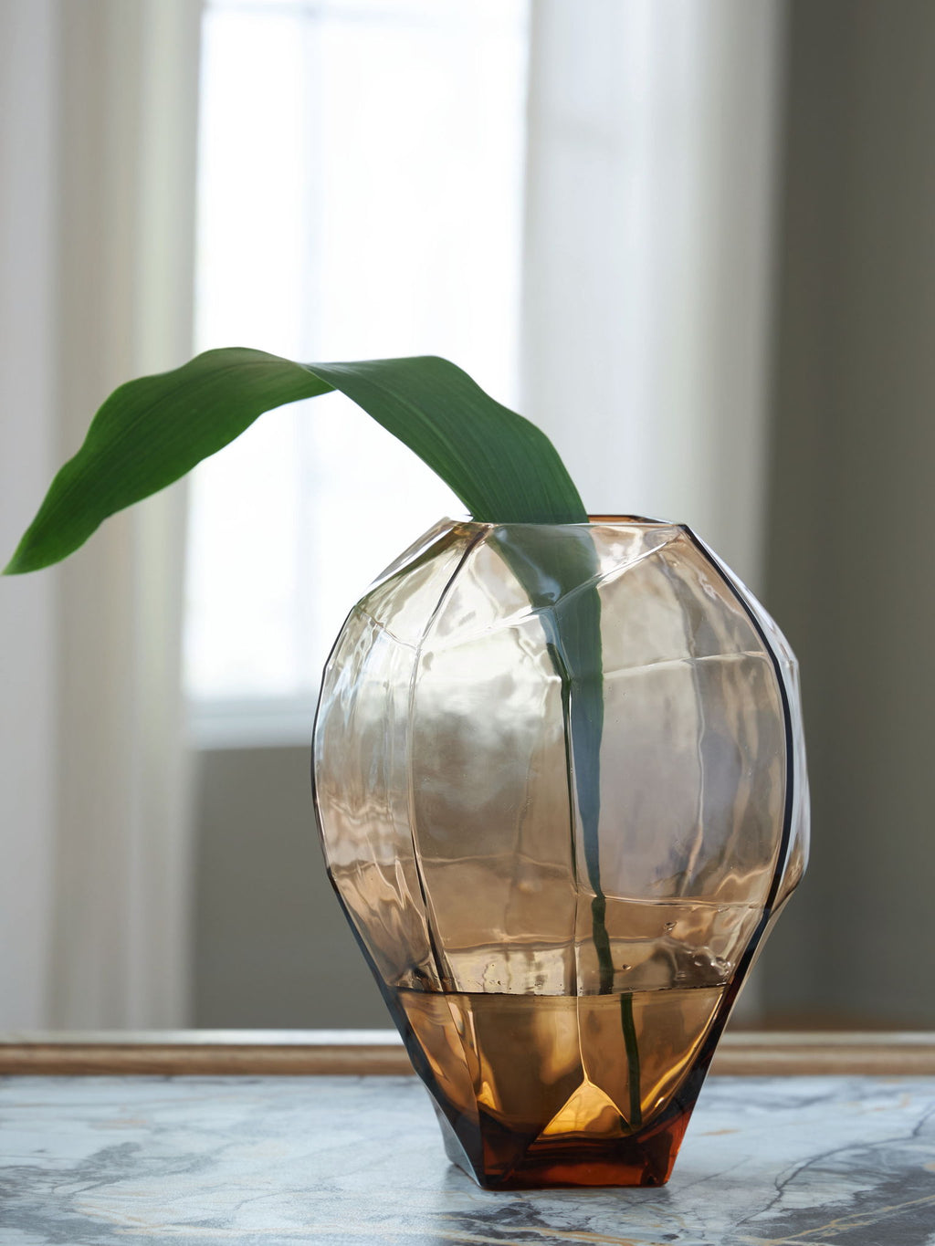 Ewart glass vase with green stems, amber-brown facets and curved base