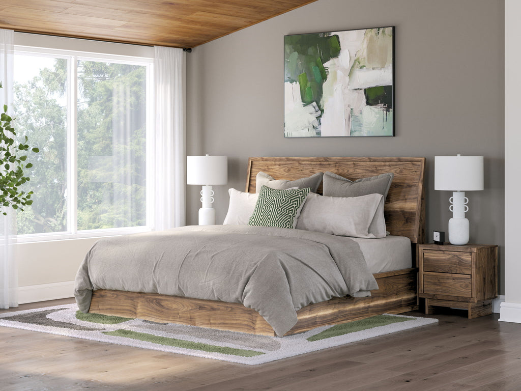 Dark brown panel bed with gray bedding and pillows, wooden headboard