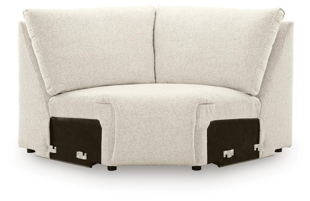 Light beige upholstered sectional wedge with two back cushions and short arms