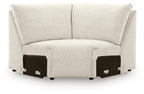 Light beige upholstered sectional wedge with two back cushions and short arms