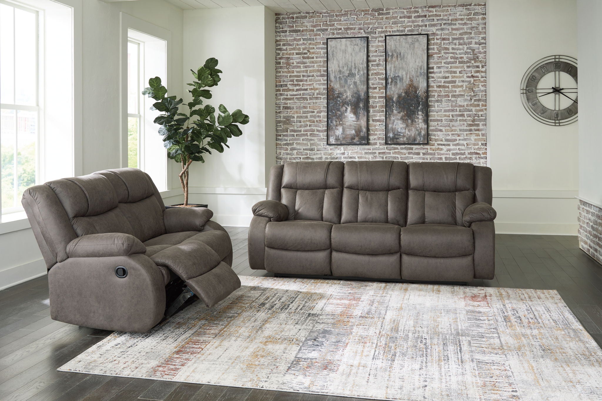 Dark gray recliner chair with padded armrest and tufted back